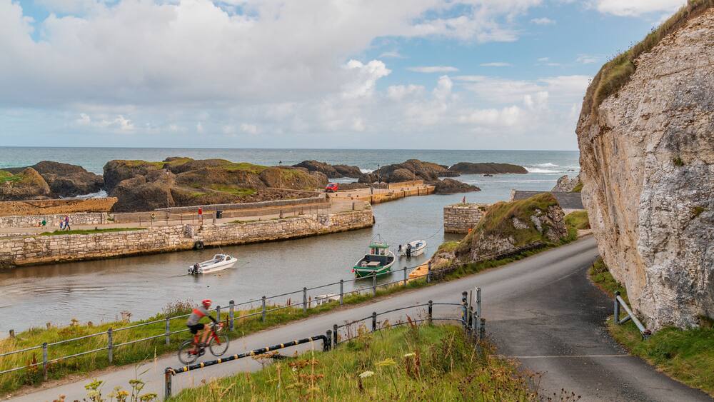 Ballycastle showing a river or creek and boating