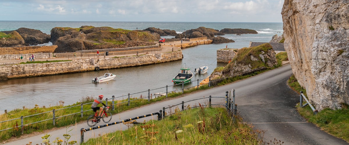 Ballycastle showing a river or creek and boating