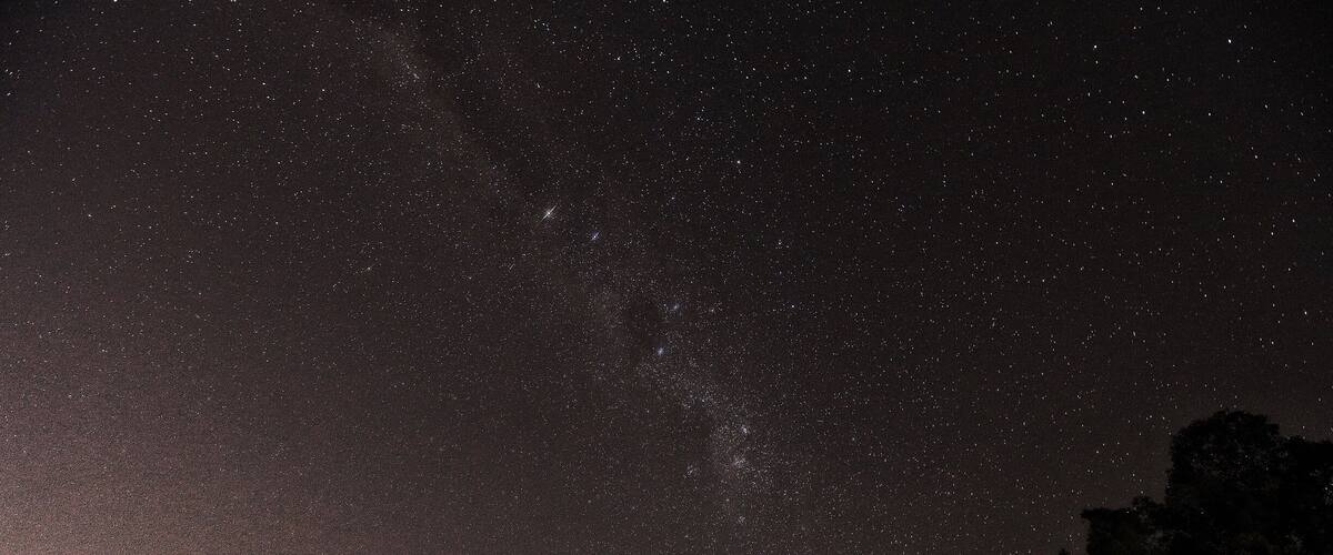 A starry night sky with visible stars and the Milky Way.