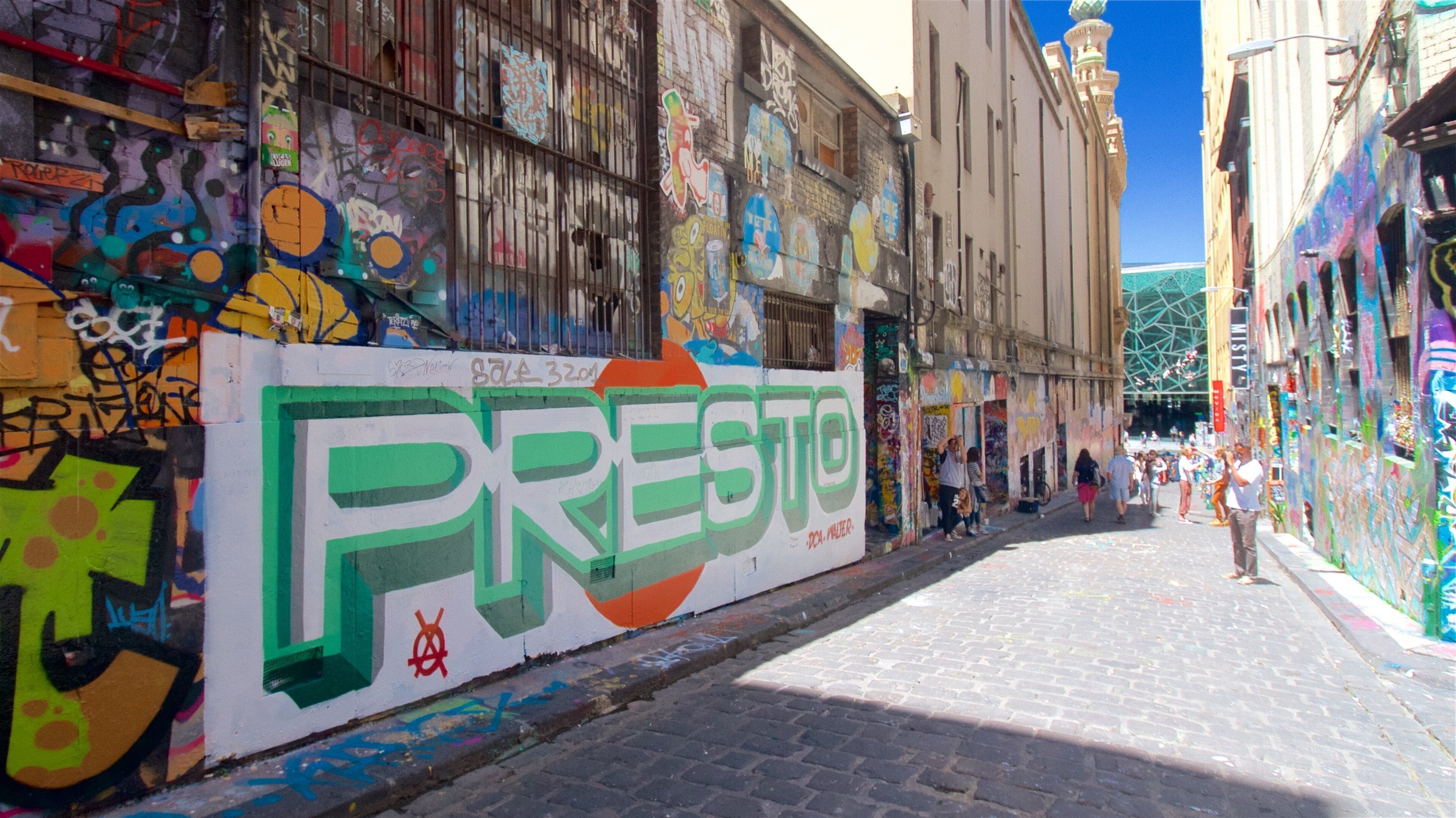 Melbourne showing street scenes and outdoor art as well as a small group of people