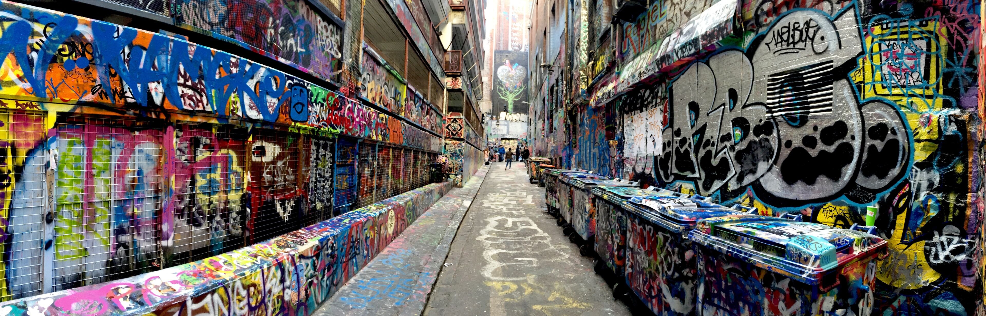 close up of a lot of colorful murales on a narrow street in Melbourne, Australia 