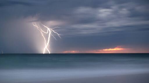 Headed down to Shorehaven Beach at golden hour.... Storm clouds brewing... Tried long exposure and captured lightning on the horizon...