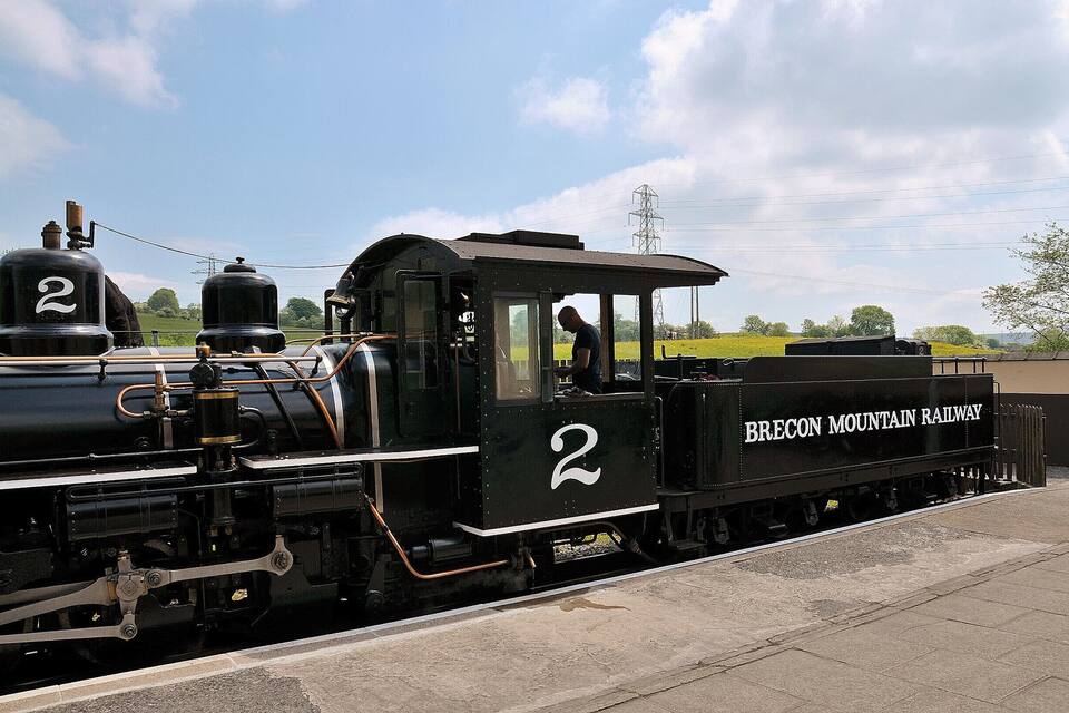 A black Brecon Mountain Railway train with the number 2 on its side.
