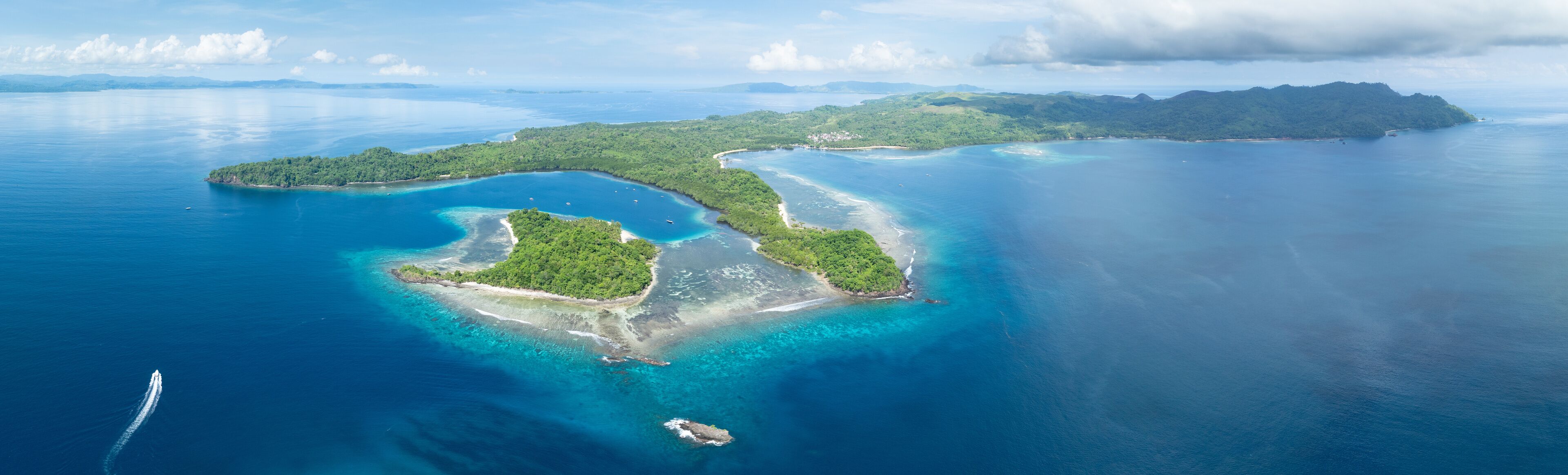 The scenic island of Bangka, just north of Sulawesi in Indonesia, is fringed by healthy coral reefs and mangroves. This area is part of the Coral Triangle and harbors astounding marine biodiversity.