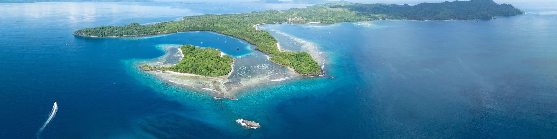 The scenic island of Bangka, just north of Sulawesi in Indonesia, is fringed by healthy coral reefs and mangroves. This area is part of the Coral Triangle and harbors astounding marine biodiversity.