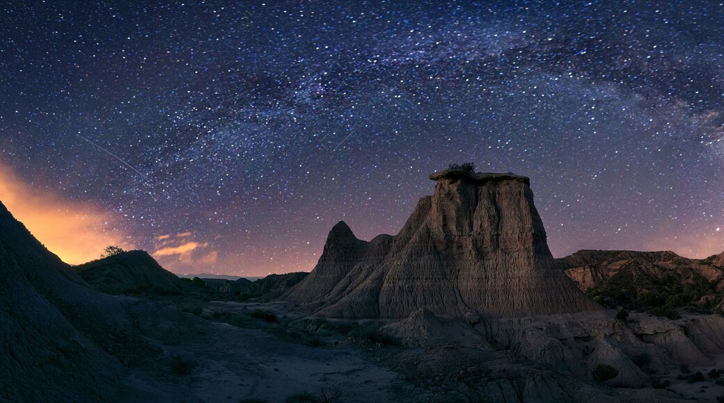 Night panorama with the Milky Way over the Monegros desert, Zaragoza, with the Tozal El Solitario under the stars