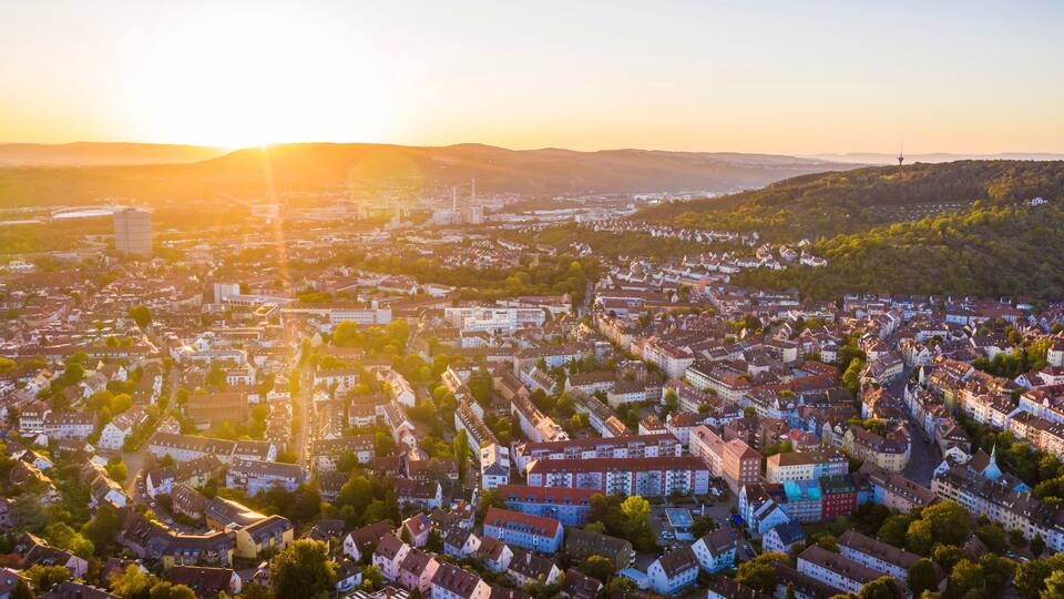 Germany, Baden-Wurttemberg, Stuttgart, Aerial view of Stuttgart-Ost and Stuttgart-Wangen quarters at sunset