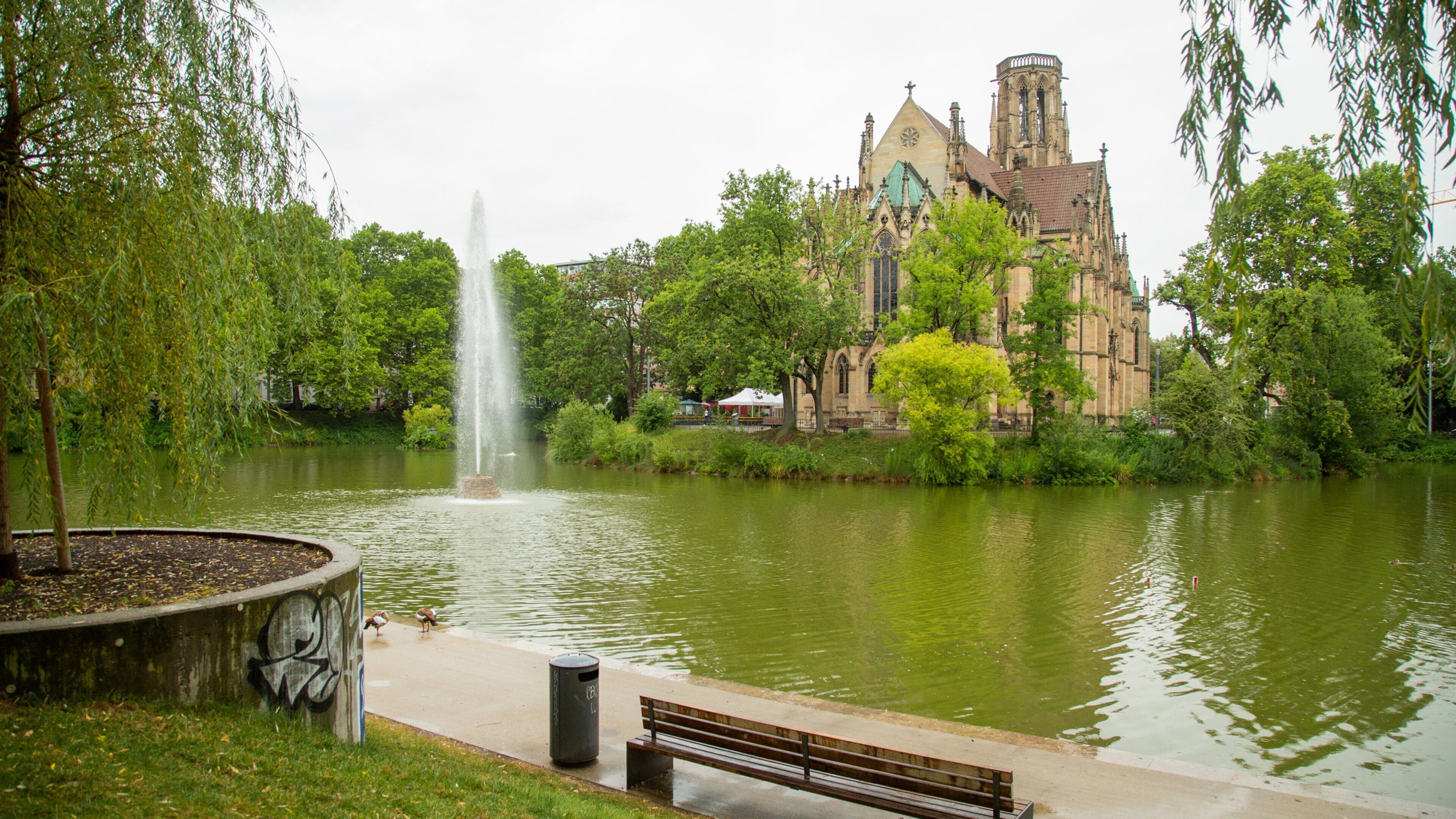 Stuttgart-West featuring heritage architecture, a church or cathedral and a pond