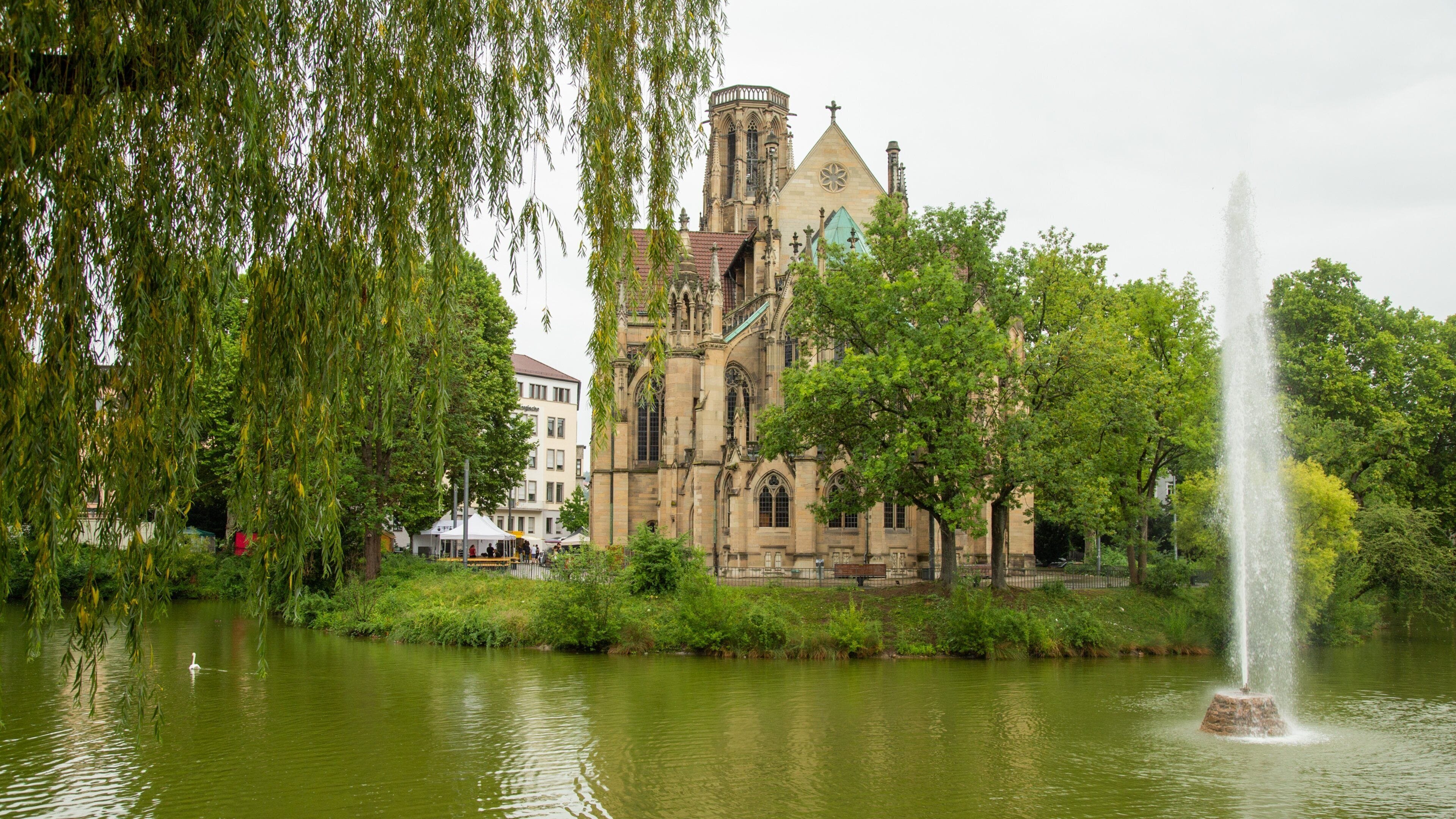 Stuttgart-West showing a fountain, a pond and a church or cathedral