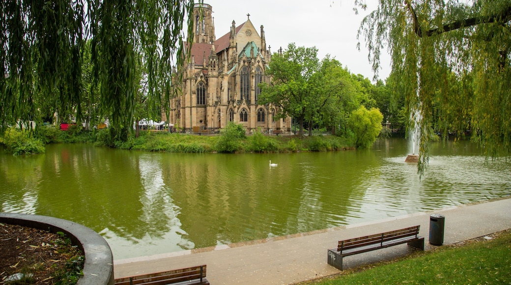 Stuttgart-West featuring heritage architecture, a church or cathedral and a pond