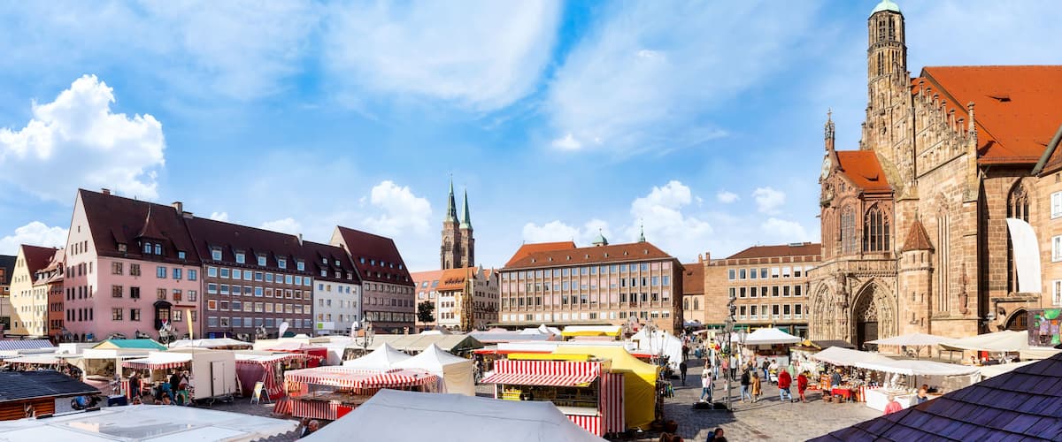 Nuremberg, Marketplace with cathedral and market stalls on a sunny day in Autumn