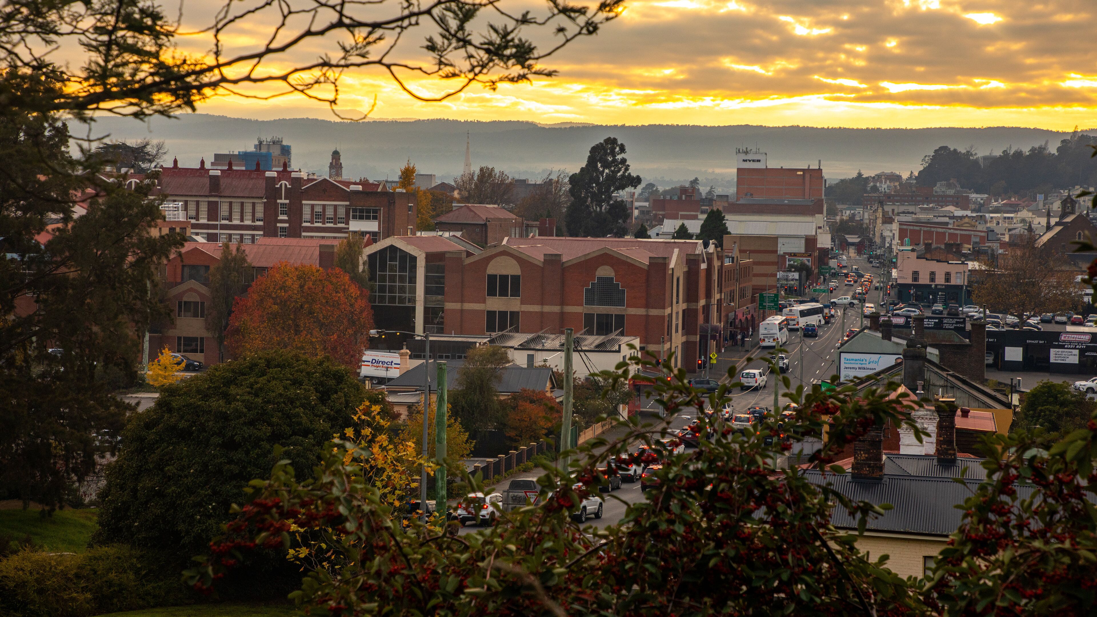 Launceston CBD which includes landscape views and a sunset