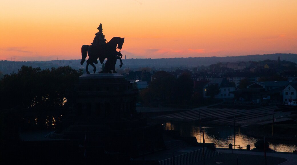 Altstadt Koblenz featuring a statue or sculpture and a sunset