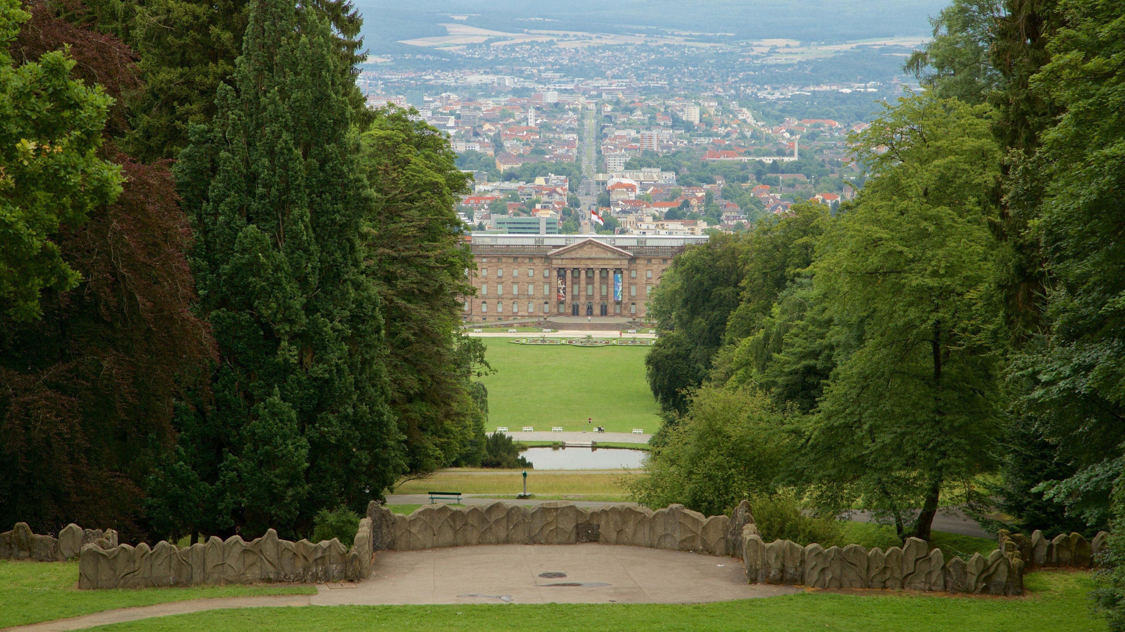 Bergpark Wilhelmshoehe showing a garden, heritage architecture and a city