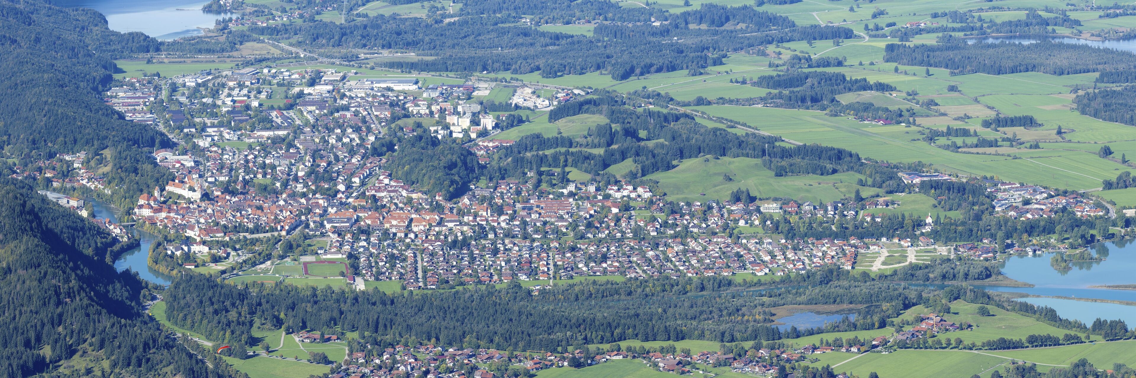 Panorama of Tegelberg, 1881m, on Füssen with historic old town, the Lech and behind it the Weissensee, on the right the Hopfensee and the Forggensee, Ostallgäu, Allgäu, Bavaria, Germany