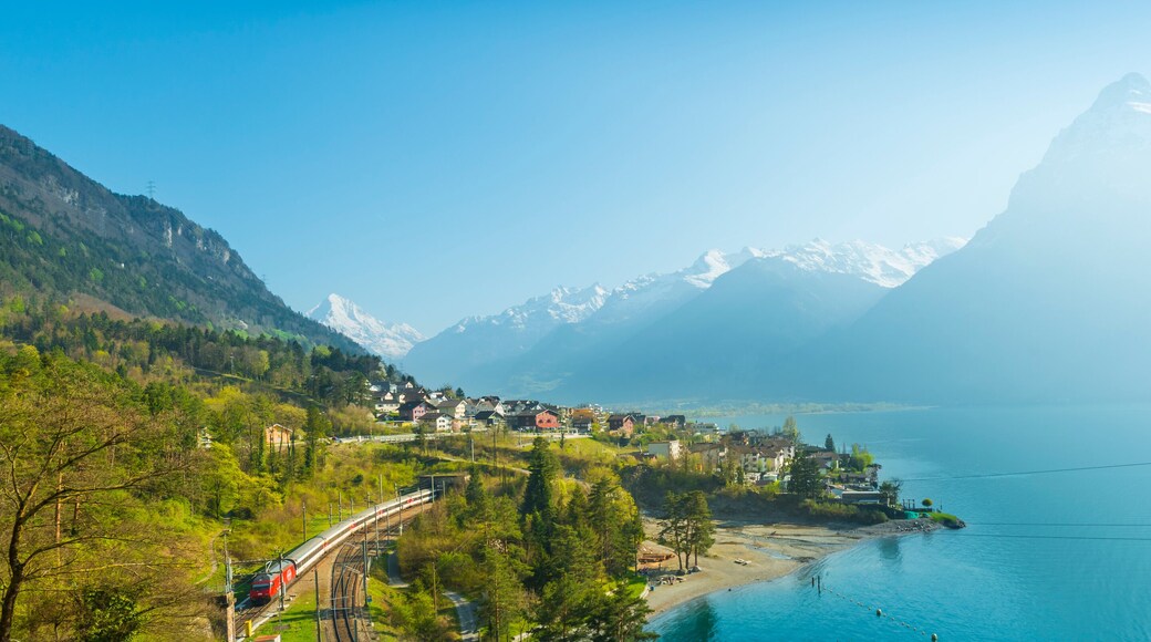 Small towns in Europe. Fluelen. Switzerland. View of the small town in the Alps mountains. Traditional houses. Railway along Lake Lucerne. Canton Uri.