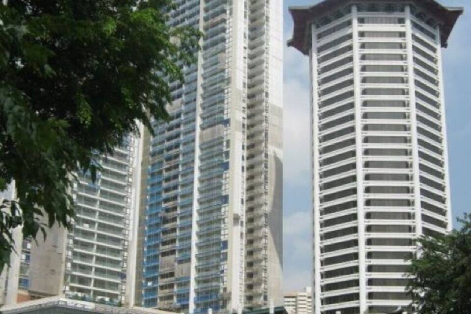 A cityscape with tall buildings, including a distinctive pagoda-style structure.
