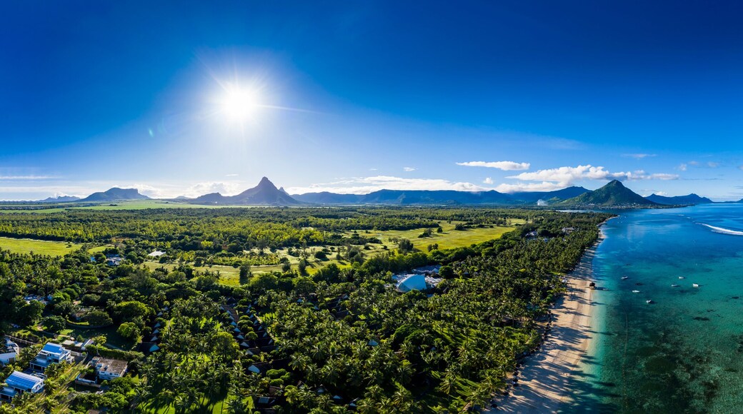 Mauritius, Black River, Flic-en-Flac, Aerial panorama of sun shining over palm trees along coastal beach in summer