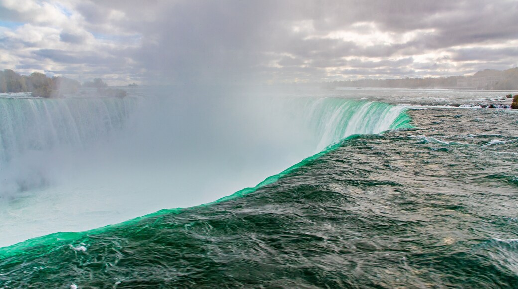 Fallsview showing mist or fog and a waterfall
