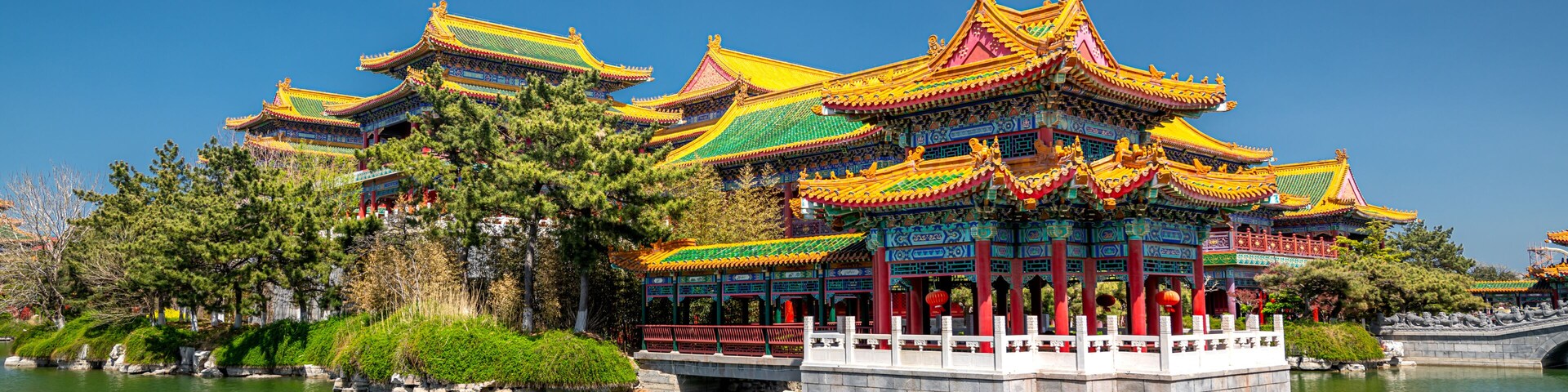 Colorful picture of green trees and Chinese pavilions in San Xian Shan tourist area, Penglai, China