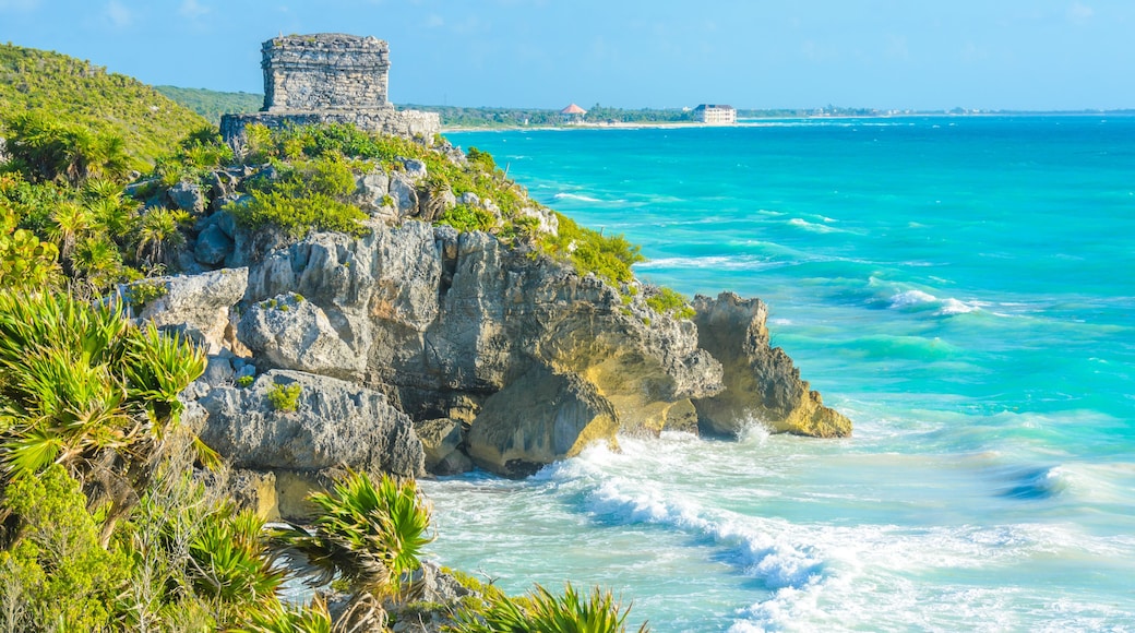 Mayan ruins of Tulum at tropical coast. God of Winds Temple at paradise beach. Mayan ruins of Tulum, Quintana Roo, Mexico.