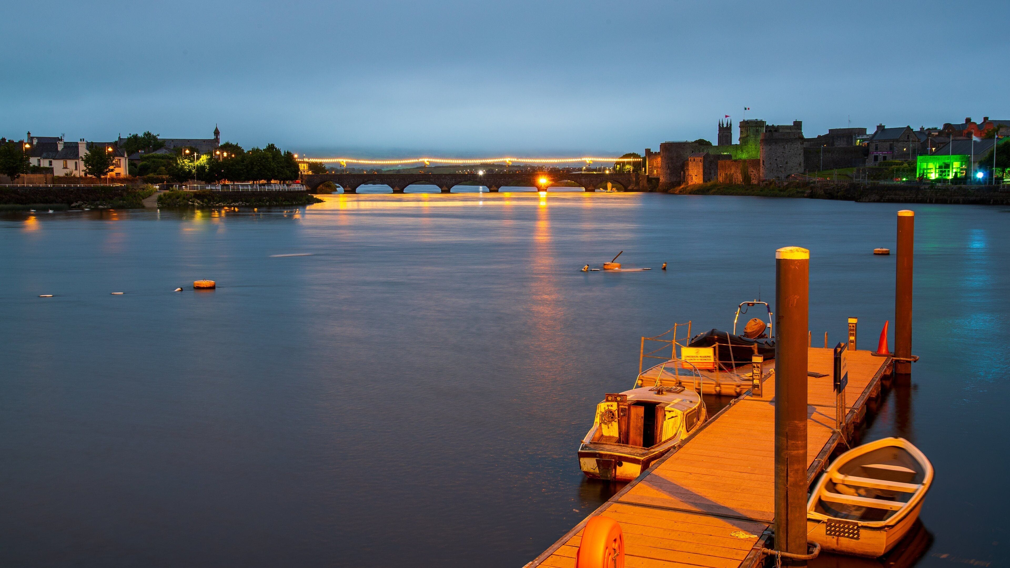 Limerick City Centre which includes night scenes and a bay or harbor
