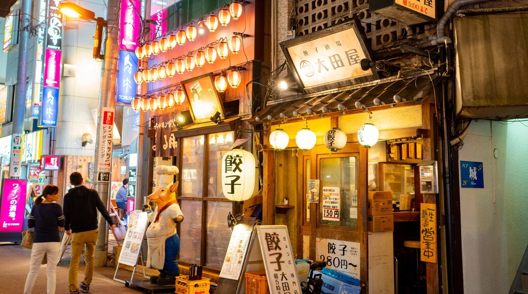 Kanda which includes street scenes, signage and night scenes