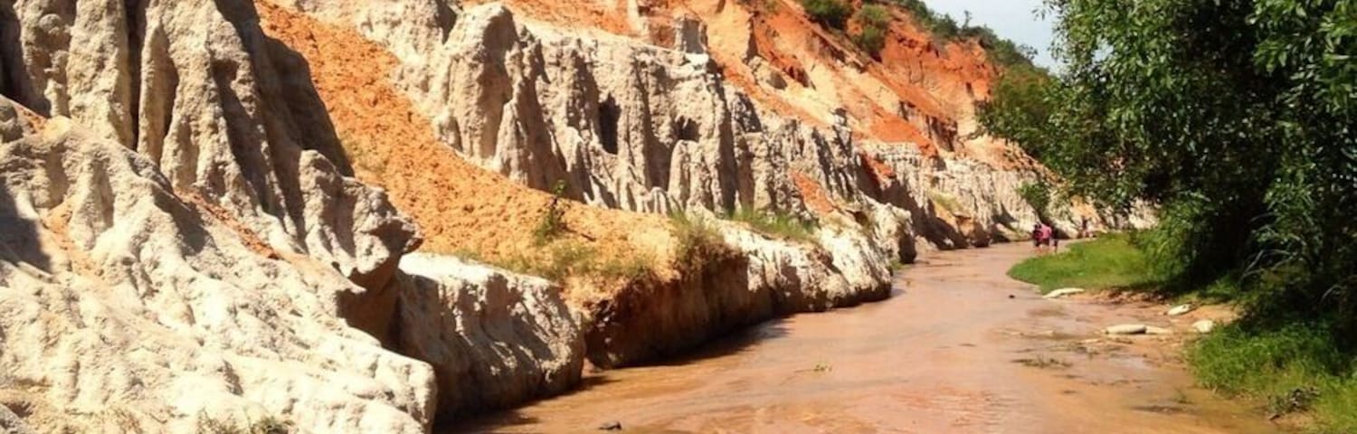 This was our 40 minute trek at FairyStream through this river to a small waterfall at the top of the stream. This area is really close to Mui Ne and there are some nice sand formations. The water looks clean in the picture, but it was polluted throughout our walk upstream. As you arrive at the river there are guys trying to charge you a fee to leave your shoes/sandals. You don't have to pay and you can take them with you. We used our Keen Sandals which were helpful as further upstream there are more rocks in the water.  This was part of an afternoon trip with Muine Backpackers travel and tour agent. We all went in a Russian Jeep to the Fairy Stream, views overlooking some fishing boats (unfortunately a very polluted beach), then onto the white sand dunes and a sunset at the red sand dunes. All of this for $7 per person. We wanted to rent a scooter but after seeing the roads on the way to the white sand dunes we were happy we didn't. Terrain for a jeep or off-road bike. The only downfall was they overbooked the tour and it was a tight squeeze in the back of the Jeep. Overall it was a good #roadtrip which combined everything you need to see in Mui Ne or surrounding area.