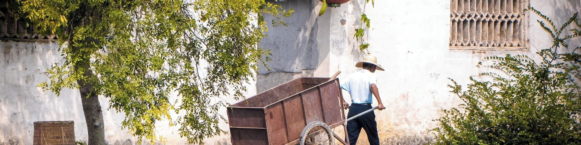 Hongcun Village was a 40 minute drive from Yellow Mountain so we included it in our Yellow Mountain adventure. It is an ancient village that is well-preserved and very photogenic. It's very common to see along the banks of the small lake artists painting their own version of it
The village dates back to the Ming dynasty with some buildings still standing from that time, most of them seemed to be from the Qing dynasty though and only America-old and not China-old.
Hongcun may be familiar to people because it is also one of the locations where Crouching Tiger Hidden Dragon was filmed.