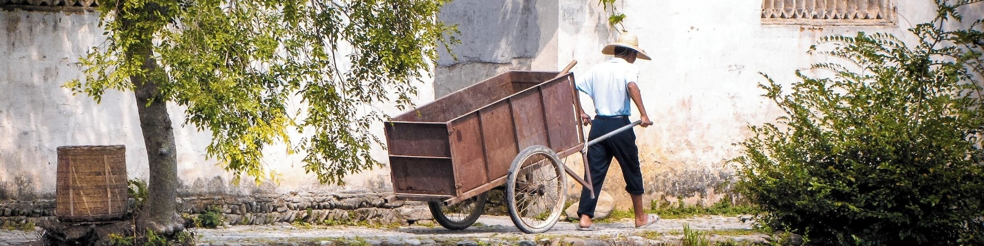 Hongcun Village was a 40 minute drive from Yellow Mountain so we included it in our Yellow Mountain adventure. It is an ancient village that is well-preserved and very photogenic. It's very common to see along the banks of the small lake artists painting their own version of it
The village dates back to the Ming dynasty with some buildings still standing from that time, most of them seemed to be from the Qing dynasty though and only America-old and not China-old.
Hongcun may be familiar to people because it is also one of the locations where Crouching Tiger Hidden Dragon was filmed.