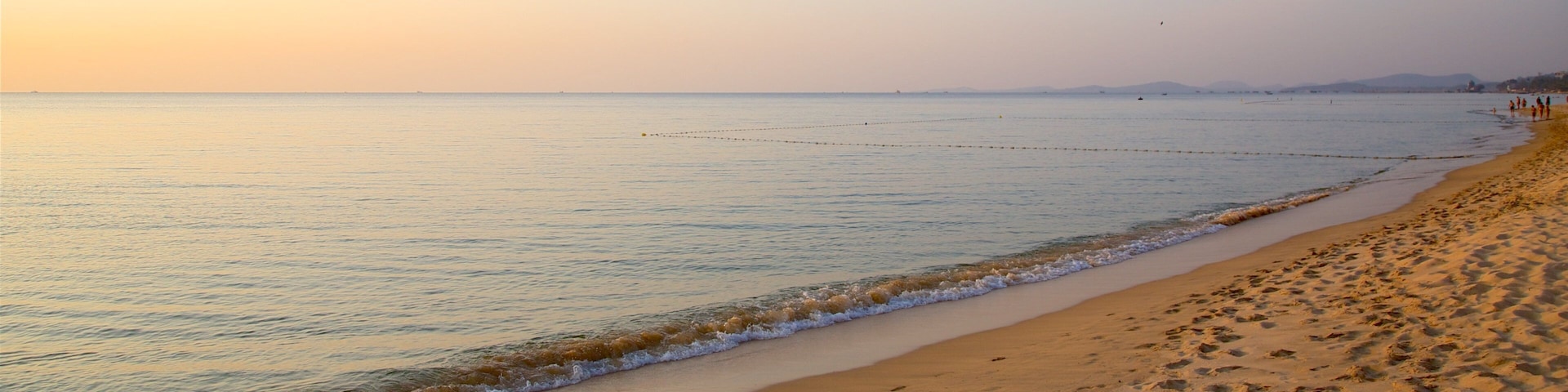 Phu Quoc Island which includes a beach, general coastal views and a sunset