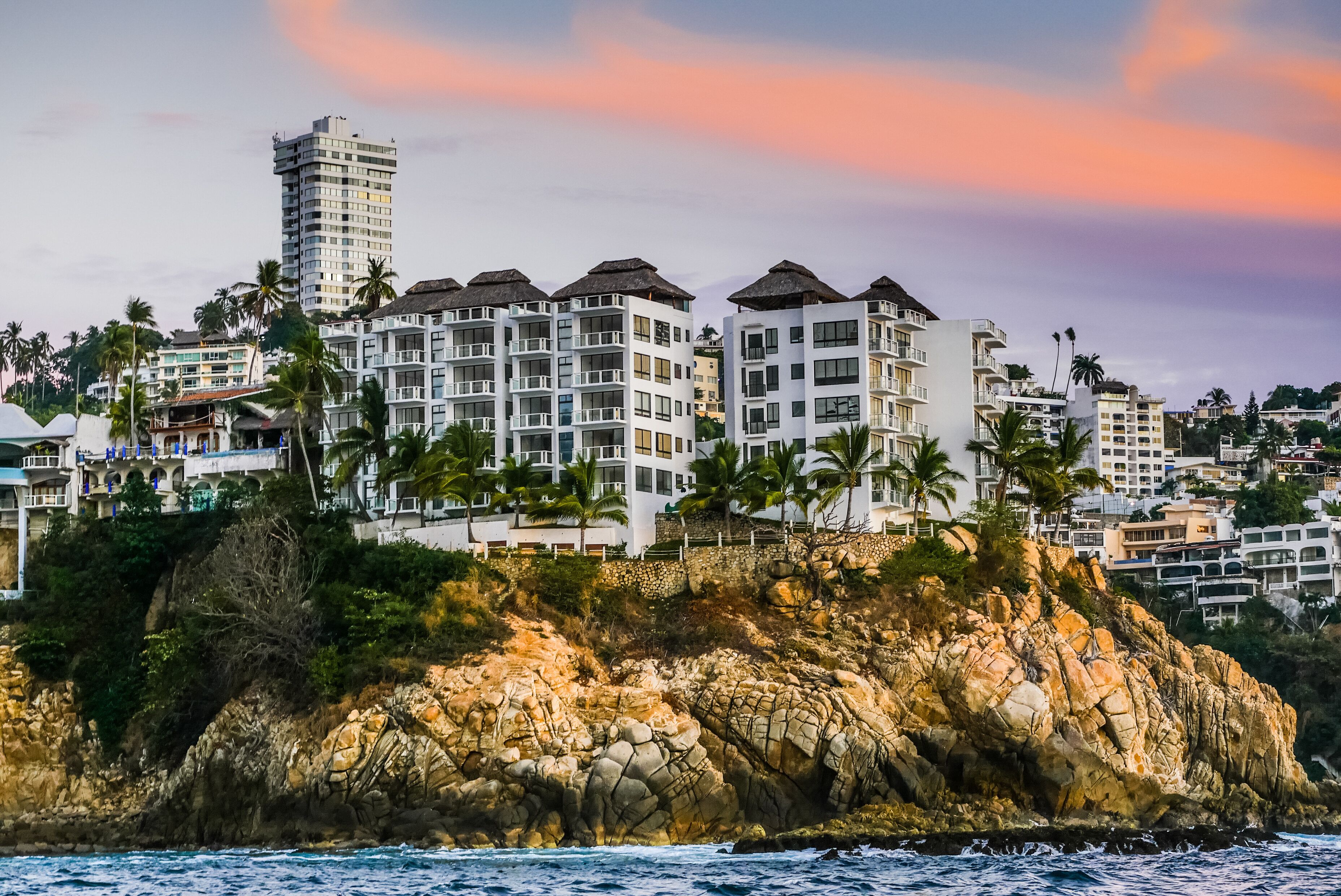 Acapulco Mexico Pacific Ocean View of the coastal line at Caleta  and clouds at the sunset
