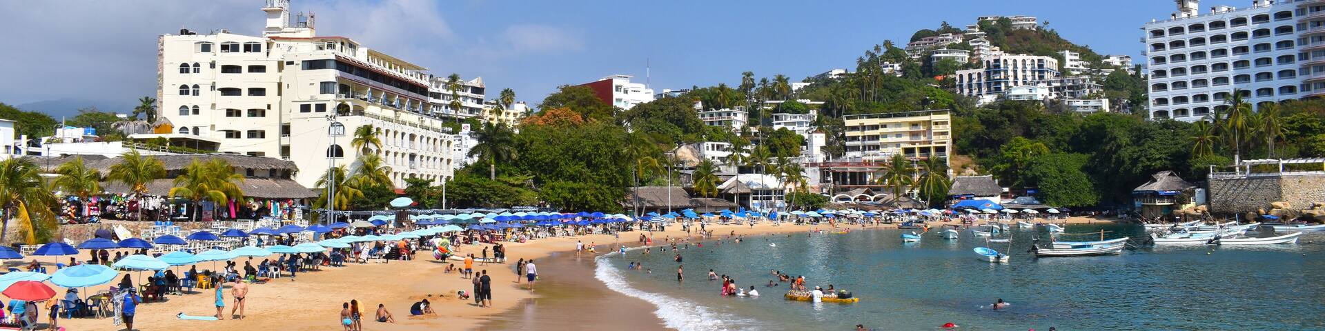 A view of Caleta beach, it can see Sand and people