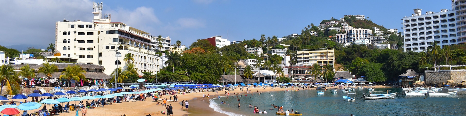 A view of Caleta beach, it can see Sand and people