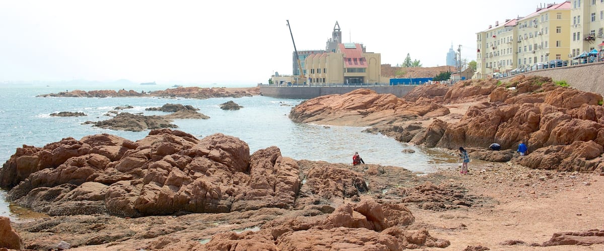 Zhanqiao which includes a coastal town, a beach and general coastal views