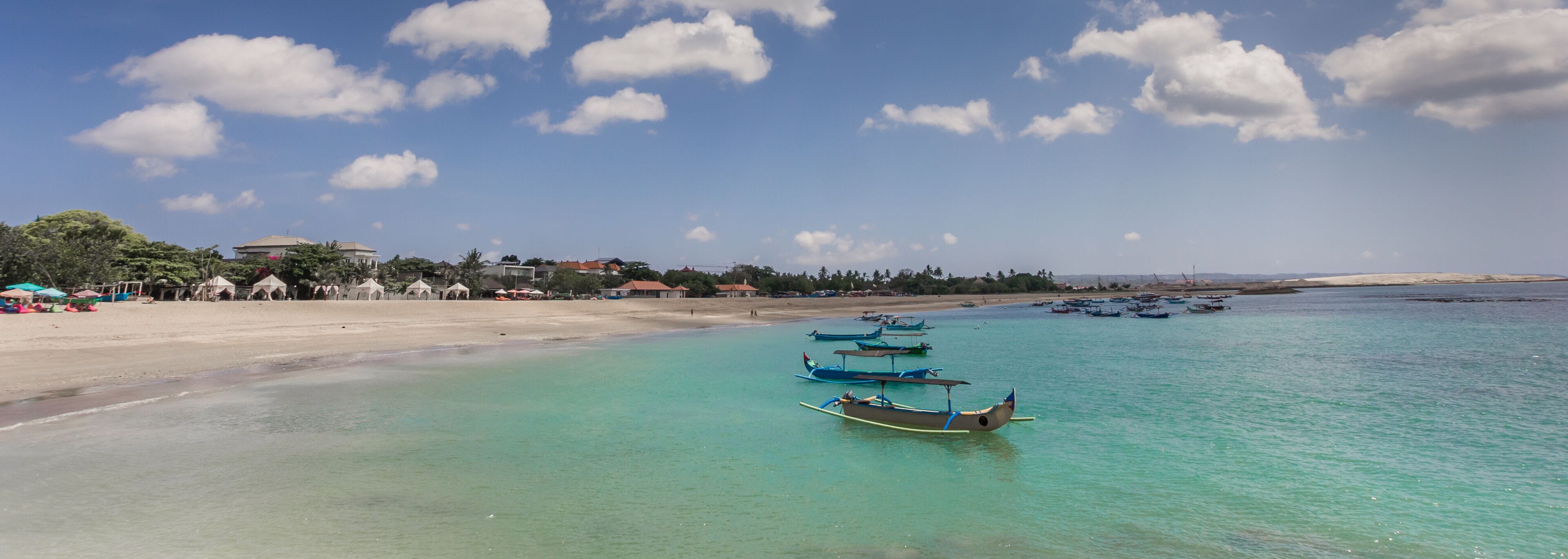 Panorama of the turquoise water in the bay of Kuta. Indonesia