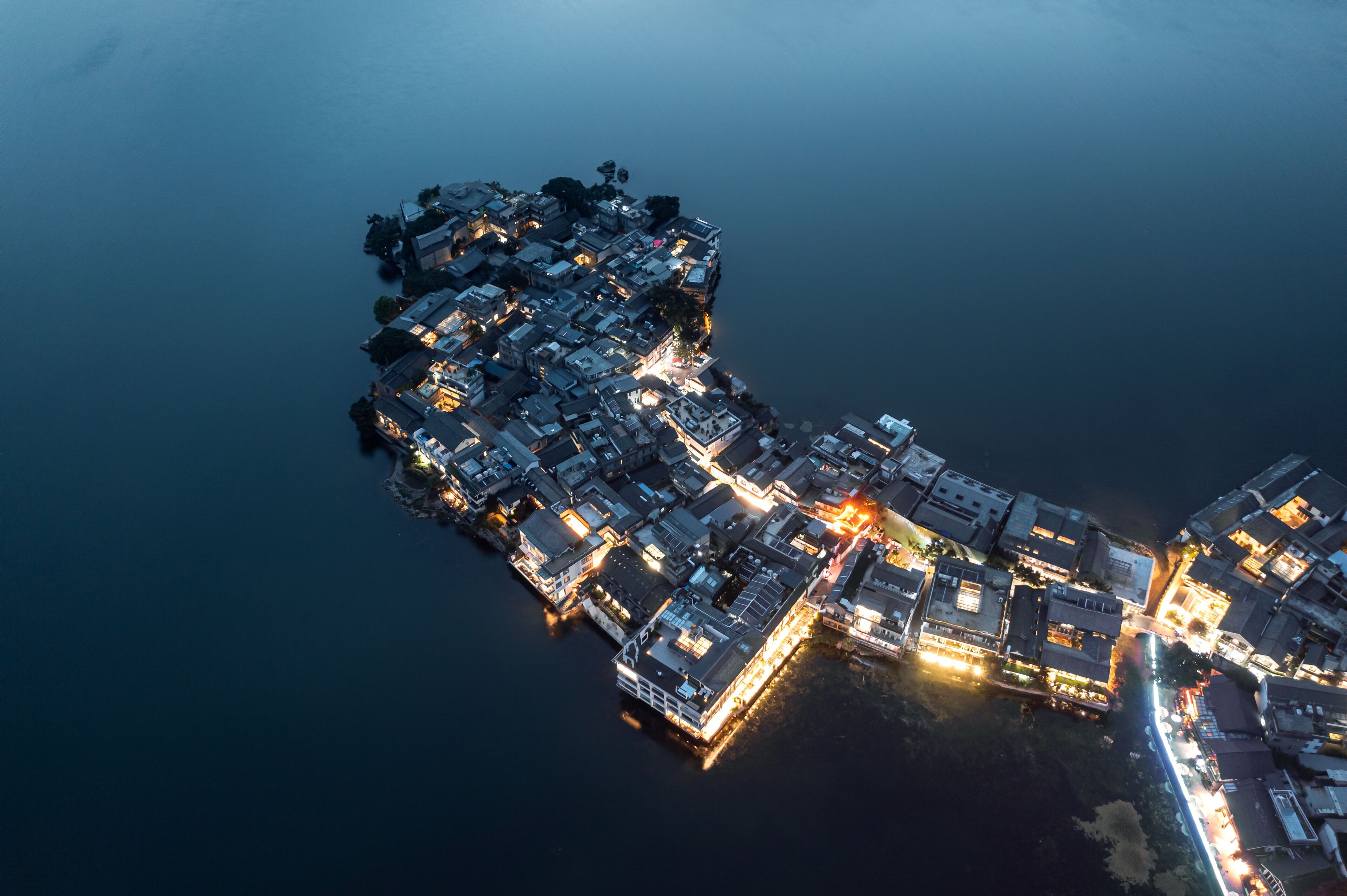 Village and lake in Shuanglang, Yunnan, China.