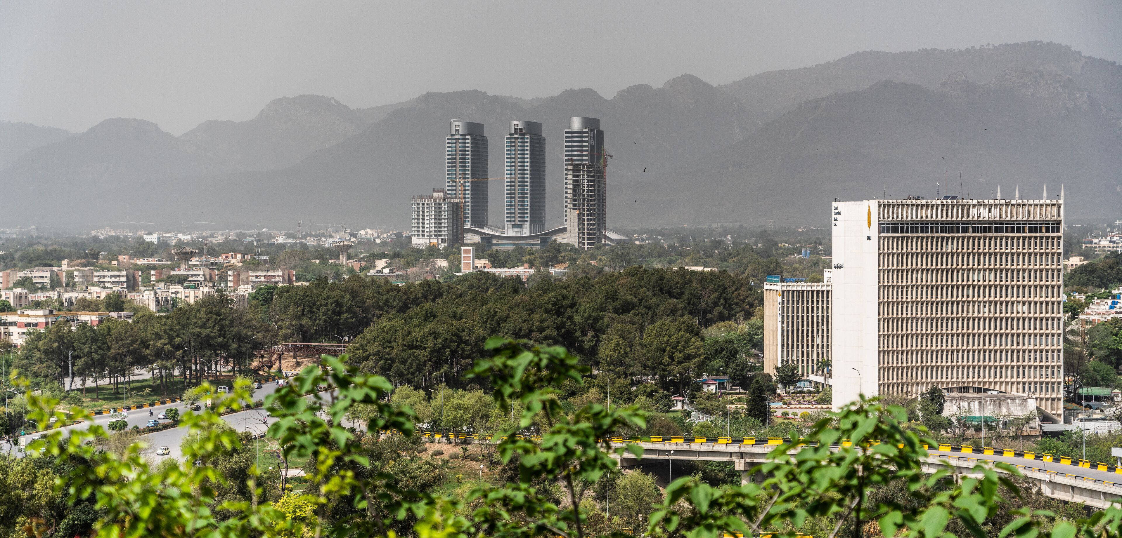 aerial landscape photography of the city of Islamabad, the capital of Pakistan with mountain range in the background - panoramic view