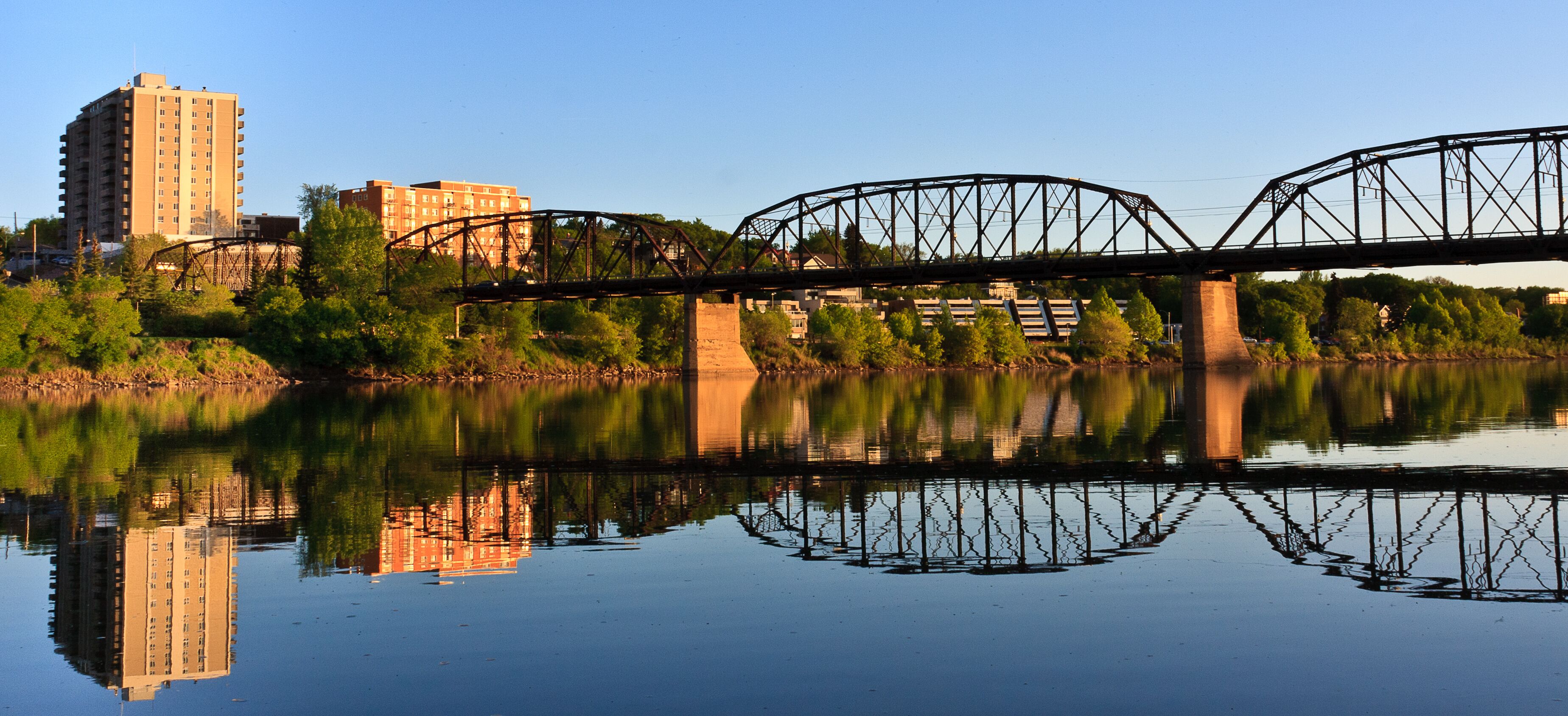 Bridge relecting in calm River