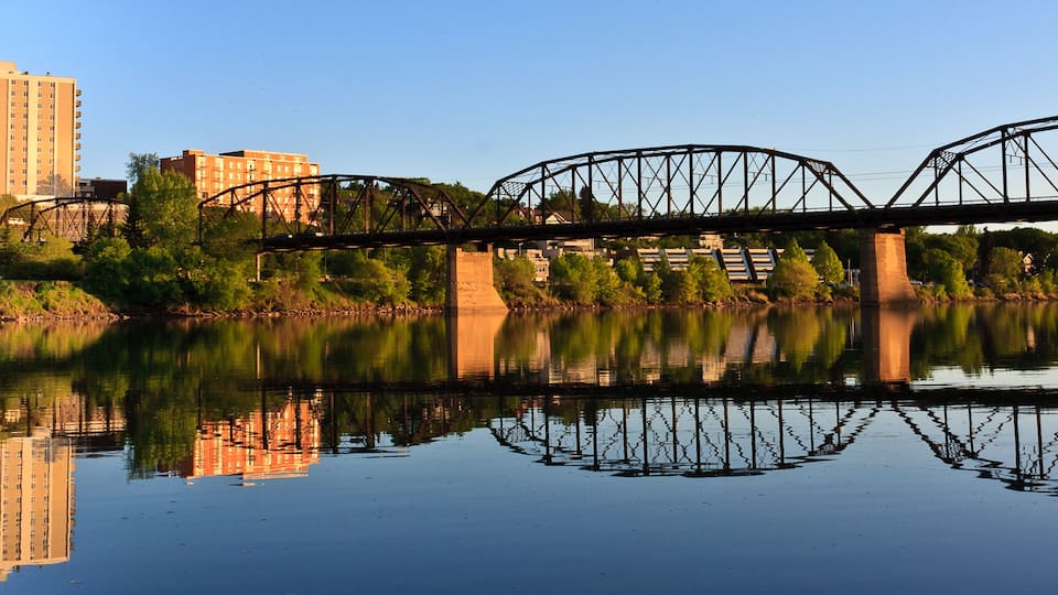 Bridge relecting in calm River
