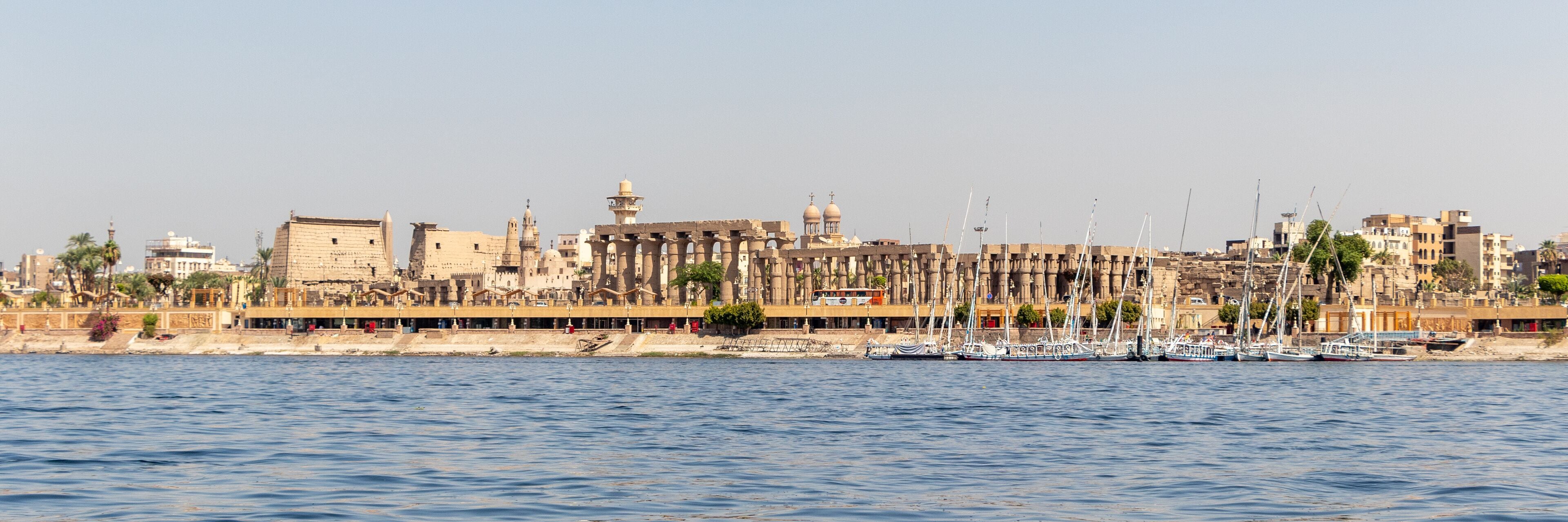 Luxor Temple is a large Ancient Egyptian temple complex on east bank of Nile river in Luxor. View from Nile river