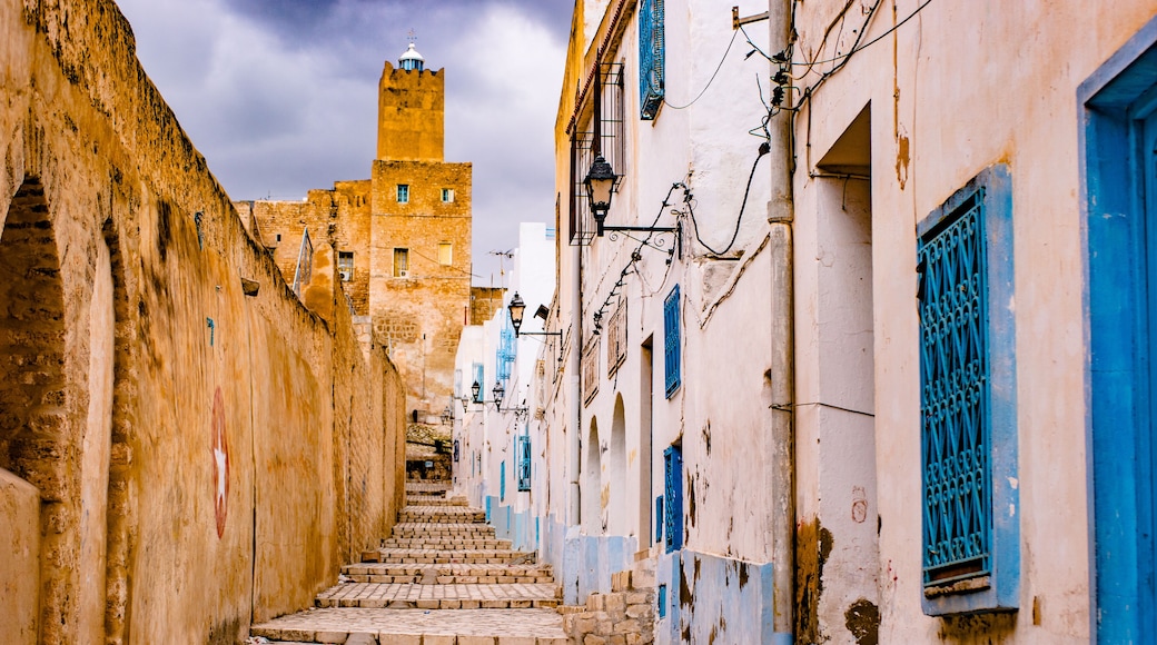 A street in Medina in Sousse, Tunisia. Magical space of medieval town with colorful walls and stone pavement.