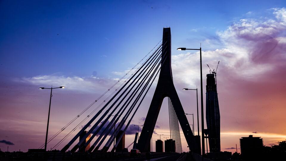 Abidjan at sunset featuring the iconic F Tower under construction from Alassane Ouattara Bridge. 2025.