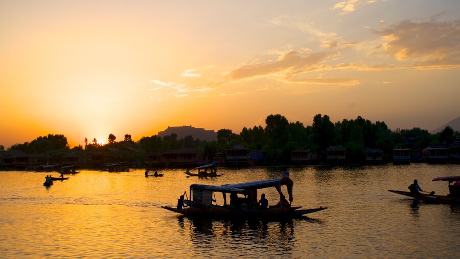 Srinagar showing a lake or waterhole, a sunset and boating