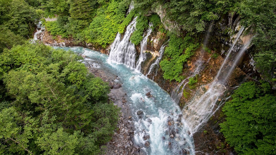Shirogane Onsen featuring rapids, a river or creek and a waterfall