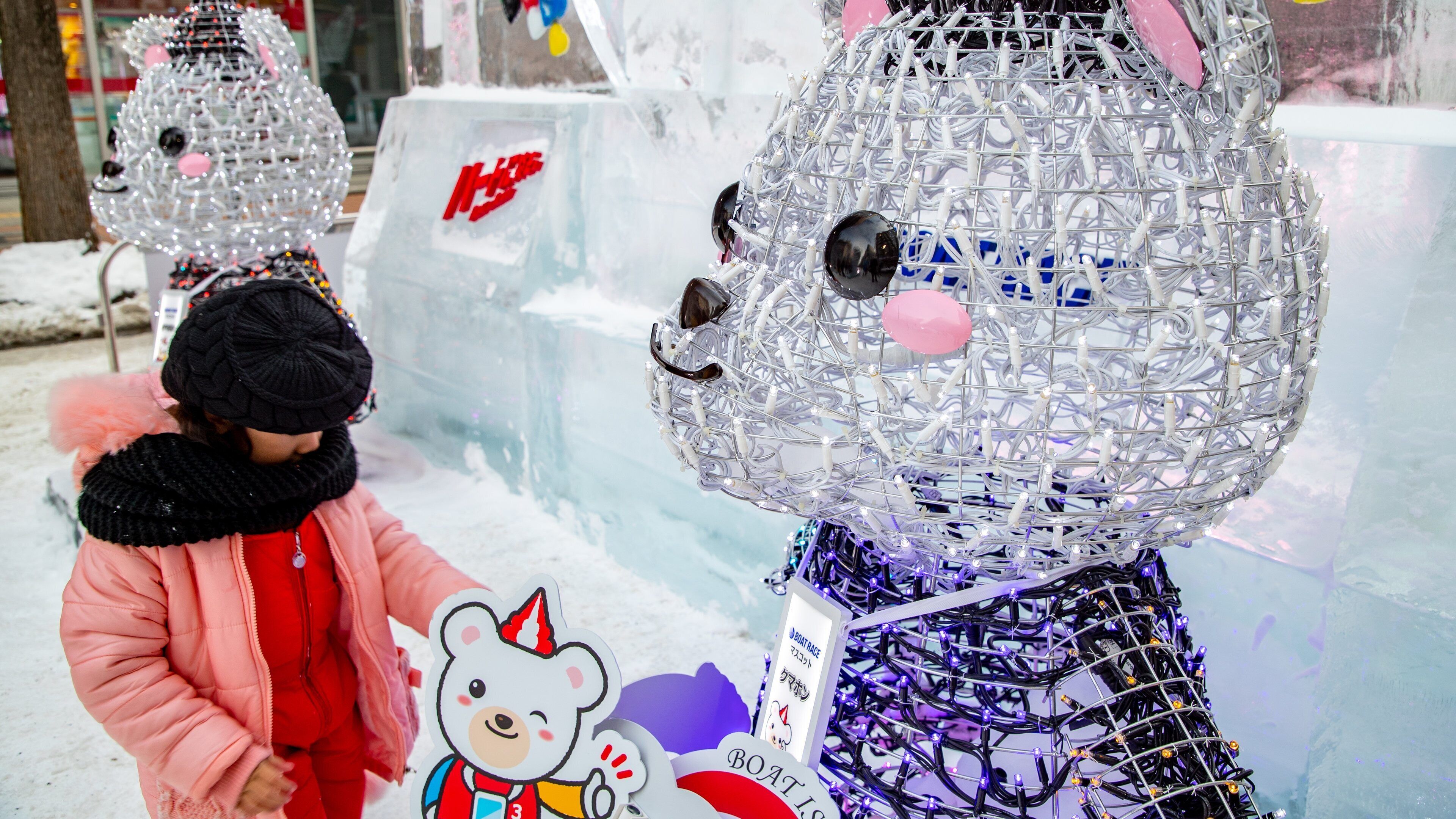 Susukino showing outdoor art as well as an individual femail