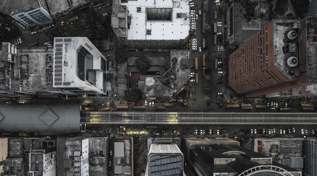 Aerial view of bustling urban landscape with high-rise buildings and railway in a vibrant business district, Motijheel Thana, Dhaka, Bangladesh.