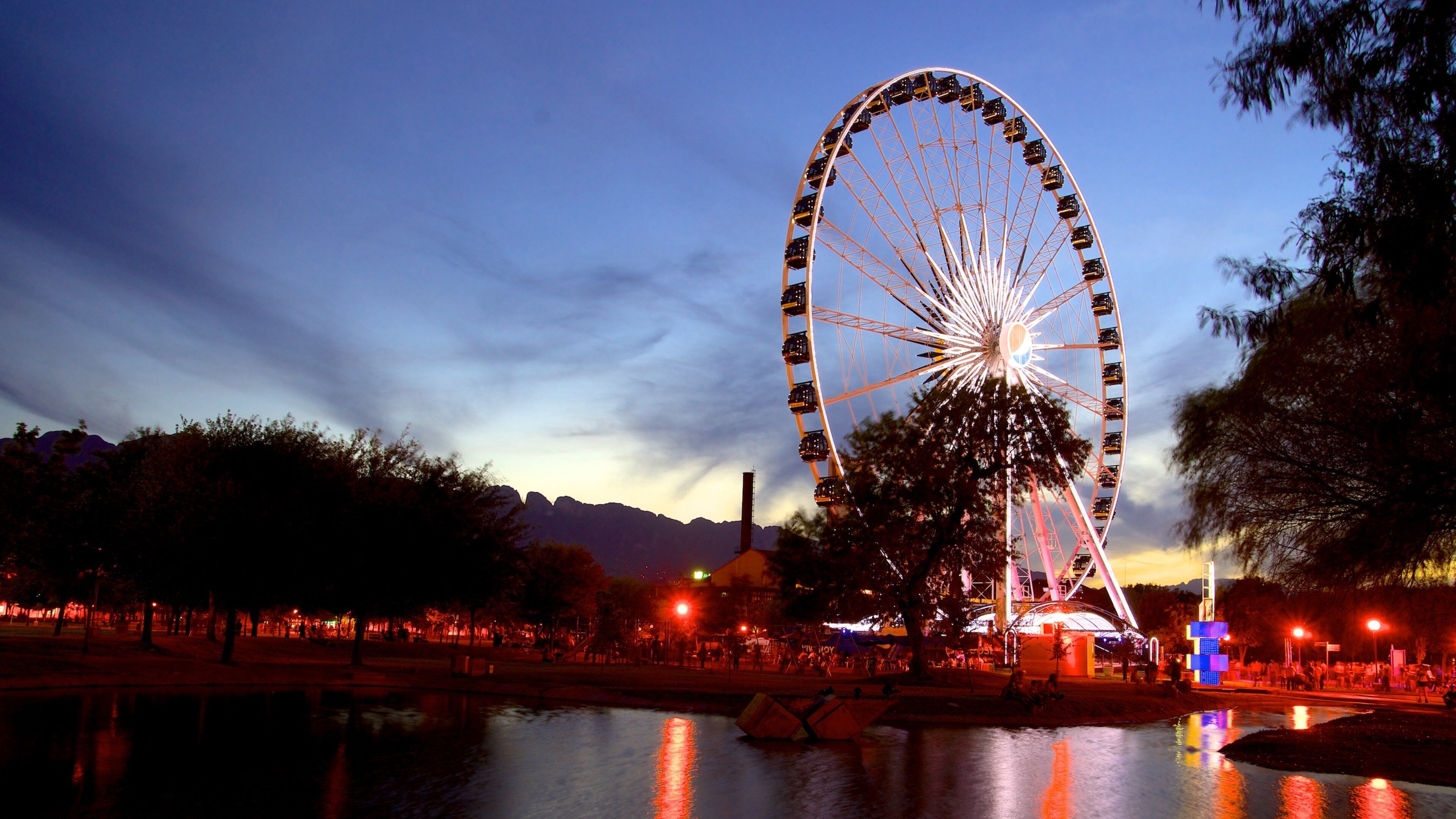 Monterrey Centro showing night scenes, a sunset and a pond