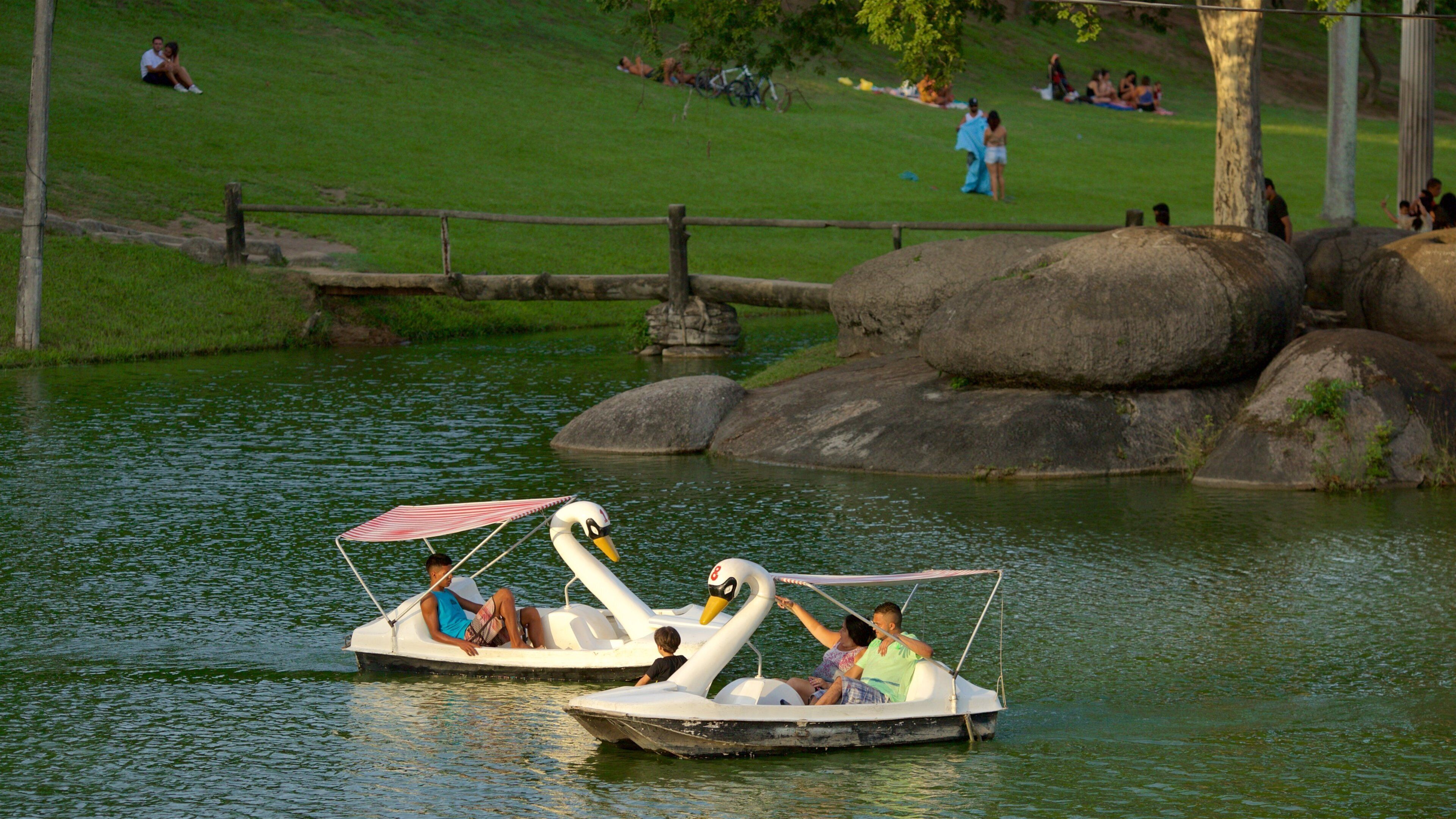 Zona Norte showing boating and a pond as well as a couple