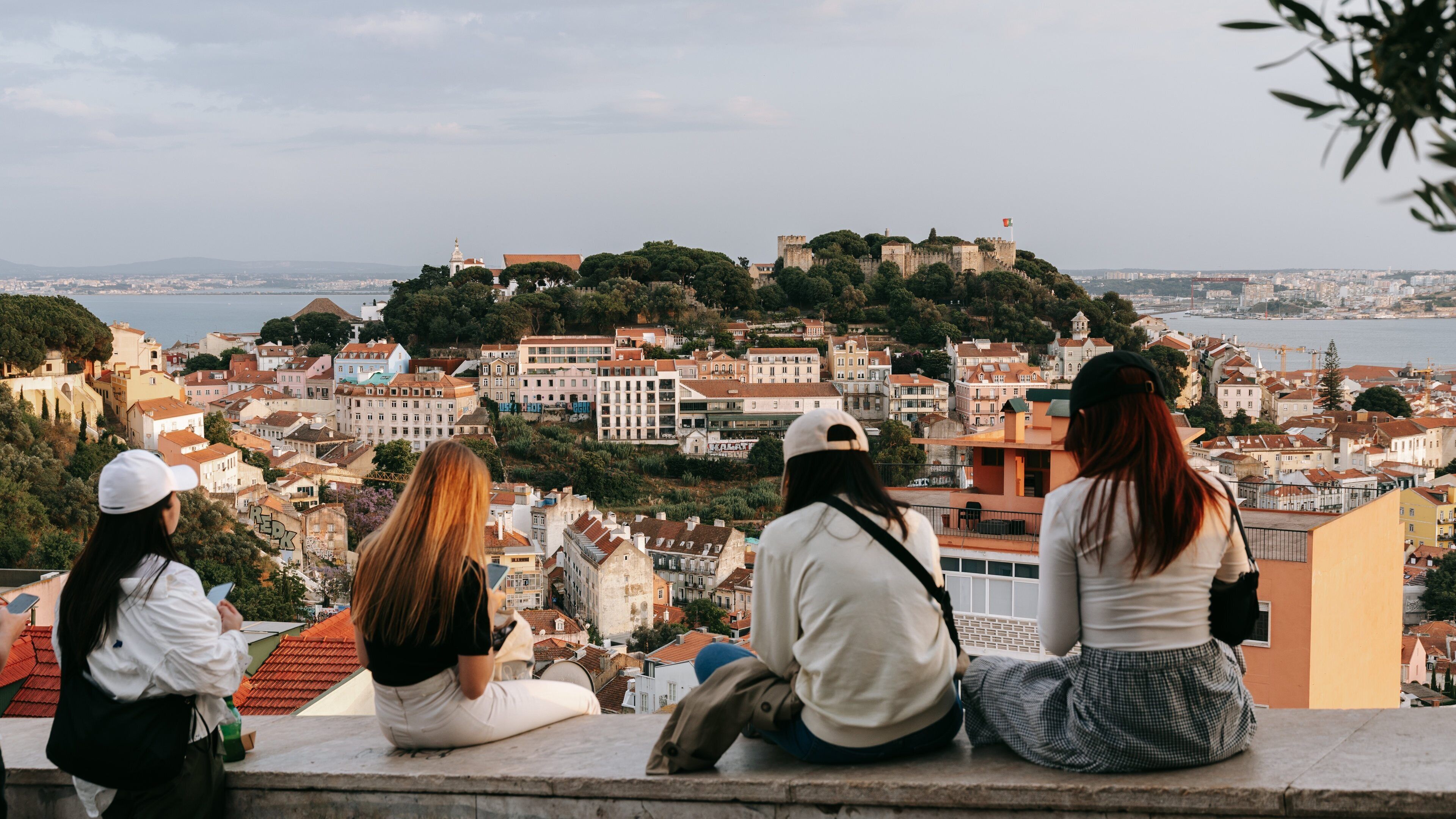 Lisbon Old Town showing a city and views as well as a small group of people